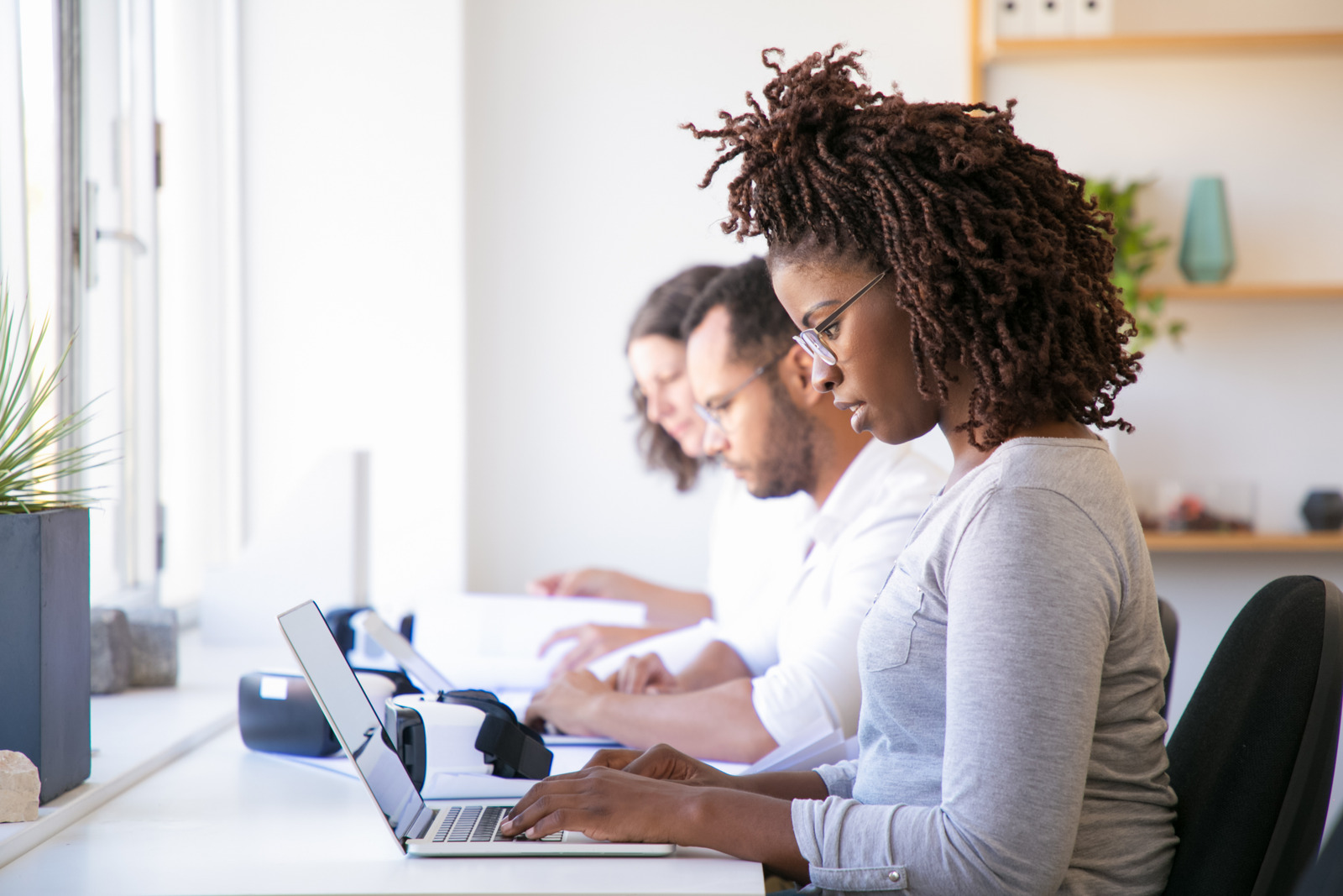 people working at a desk